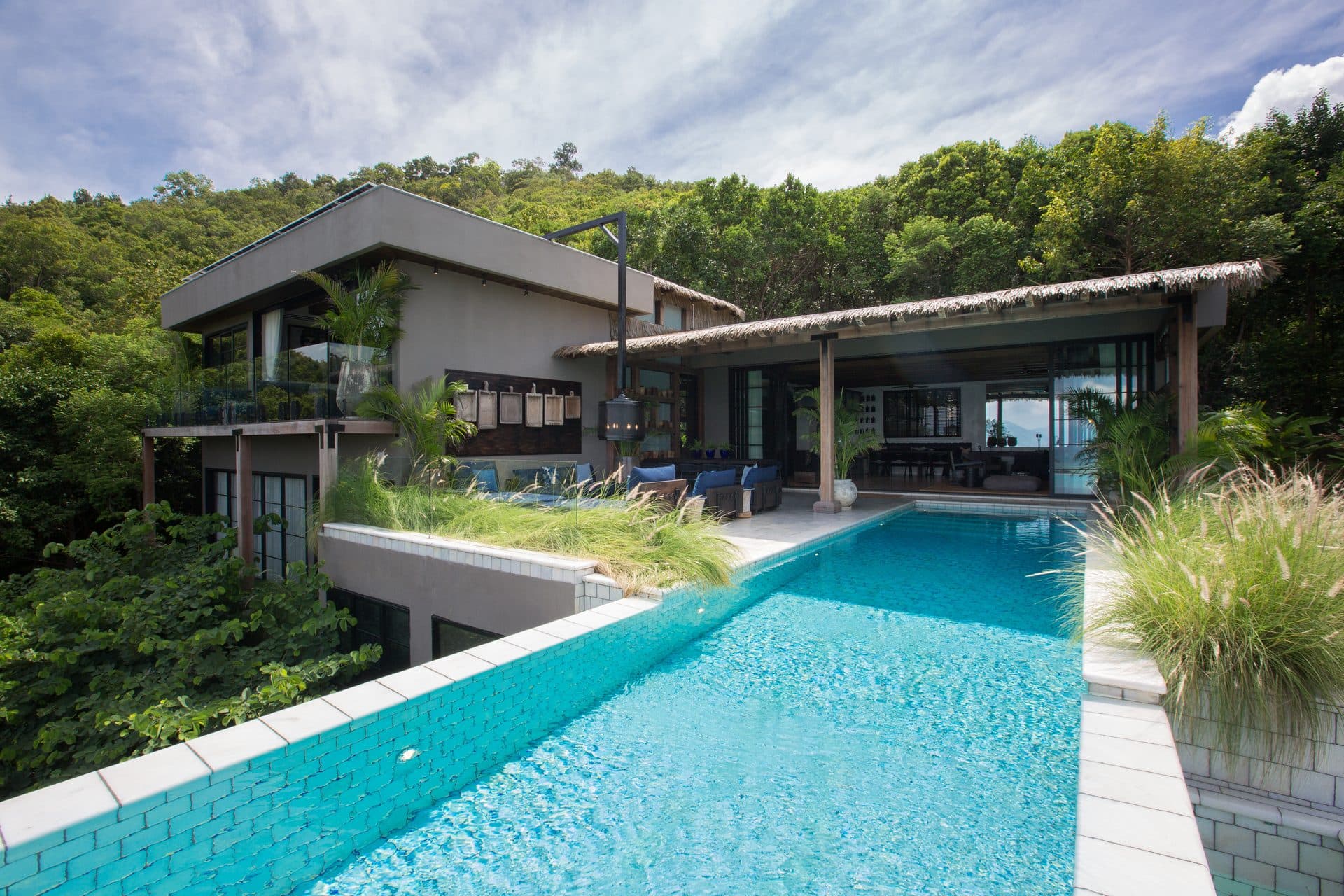 Villa Kram exterior with infinity pool against the Koh Samui hillside